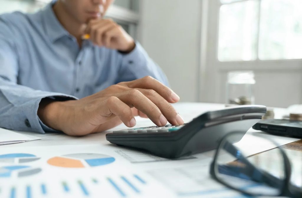 image of a man doing a calculation