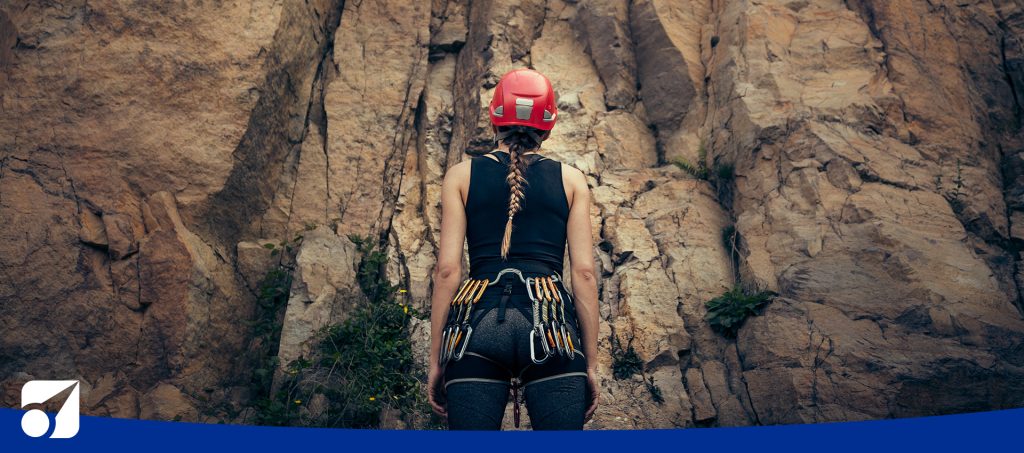 image of a woman looking at a climb
