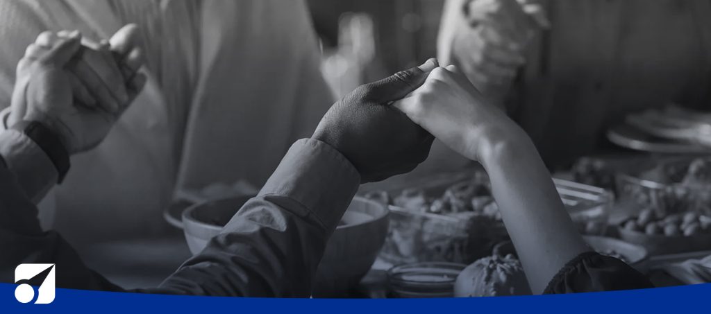 people praying before dinner
