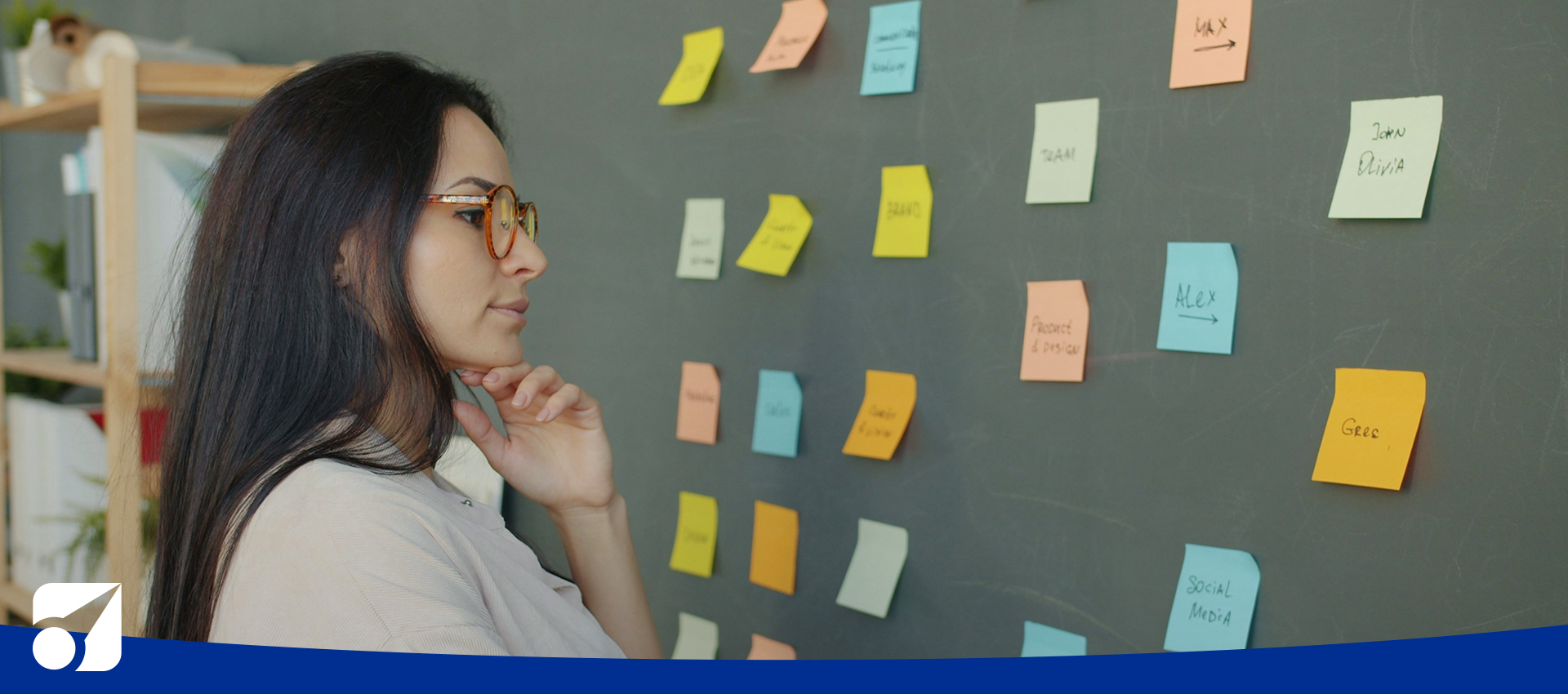 a woman looking at sticky notes